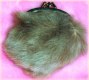 Cool fluffy purse. People'll think it's a rat when you pull it out